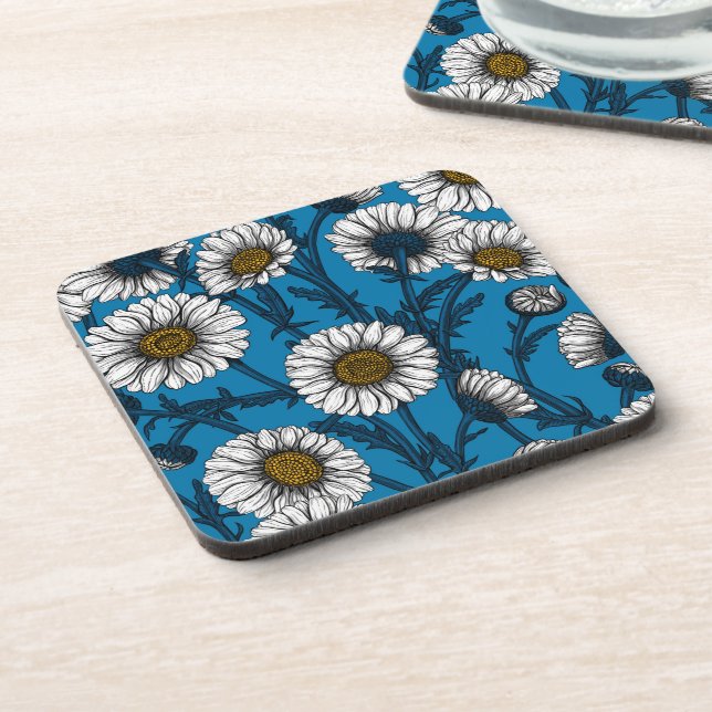 Daisies on blue beverage coaster (Left Side)