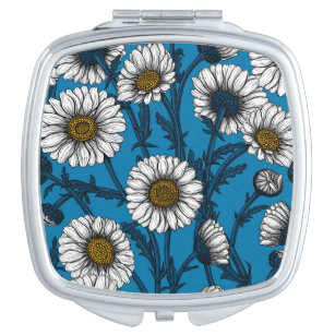 Daisies on blue compact mirror