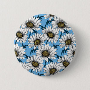Daisies, wild flowers on blue button