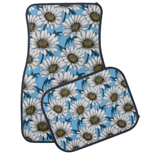 Daisies, wild flowers on blue car floor mat