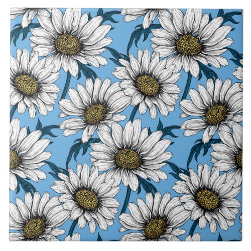 Daisies wild flowers on blue ceramic tile