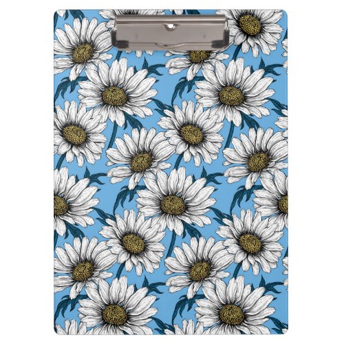 Daisies wild flowers on blue clipboard