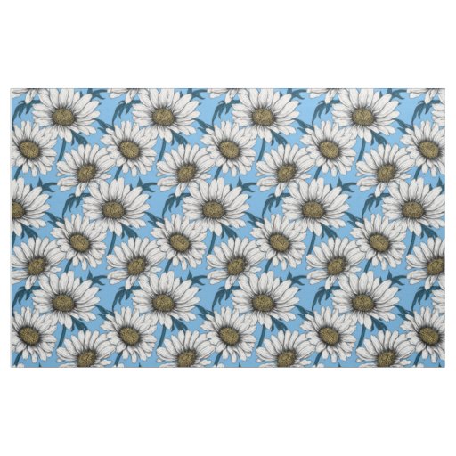 Daisies, wild flowers on blue fabric