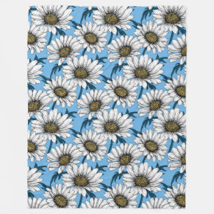 Daisies, wild flowers on blue fleece blanket