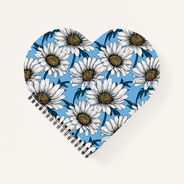 Daisies, wild flowers on blue notebook (Front)