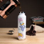 Daisy Duck Blowing a Kiss Water Bottle<br><div class="desc">Spread a little love with this timeless and charming Daisy Duck character graphic! Captured in a classic, flirtatious pose blowing a delicate heart-shaped kiss, this design radiates sweetness and personality. With her iconic pink bow, purple blouse, and matching heels, this illustration is a beautiful celebration of classic animation style. The...</div>