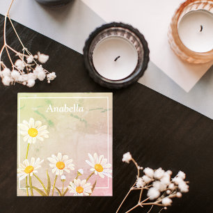 Daisy flower frame on a vintage background notepad