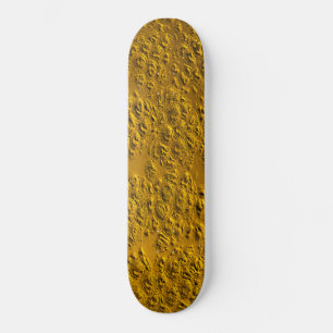 Damaged gold skateboard