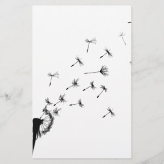 Dandelion puff in the wind