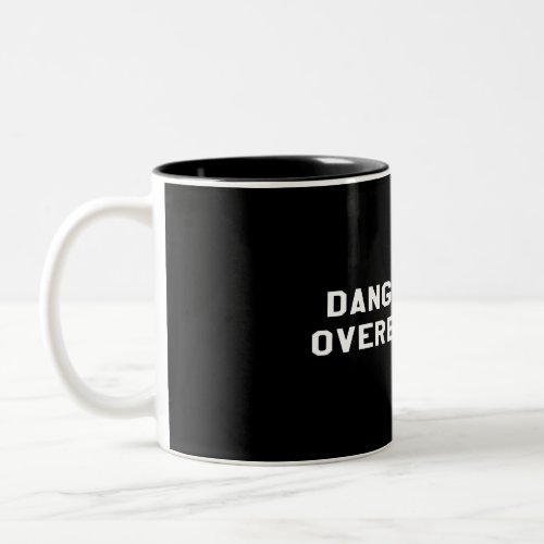 Dangerously overeducated white writing  Two_Tone coffee mug