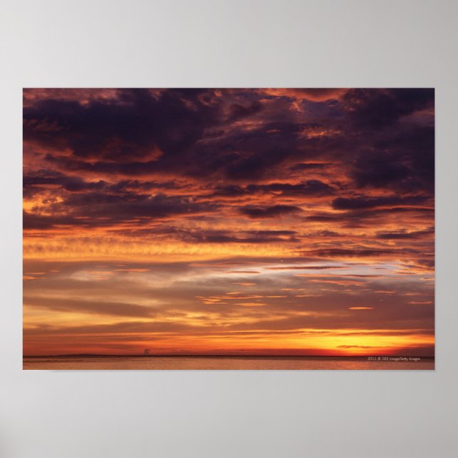 Dark clouds in orange streaked sky poster (Front)