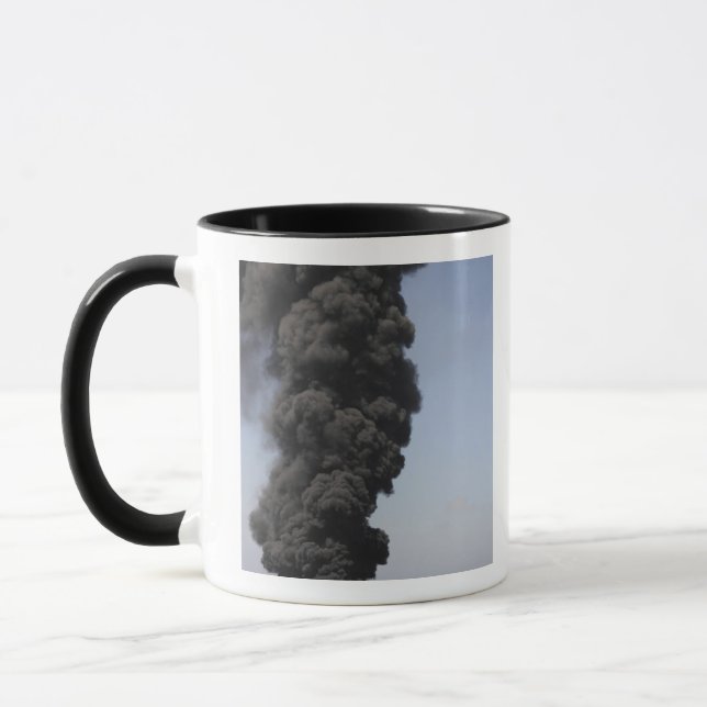Dark clouds of smoke and fire emerge mug (Left)
