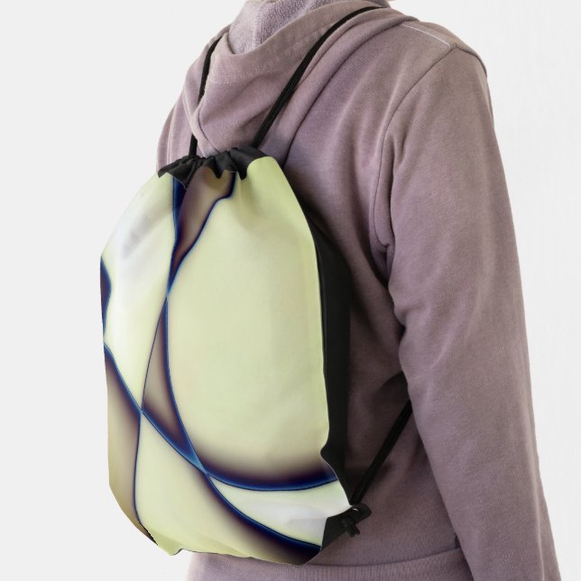Dark curved lines on blue shadow over cream beige  drawstring bag (Insitu)