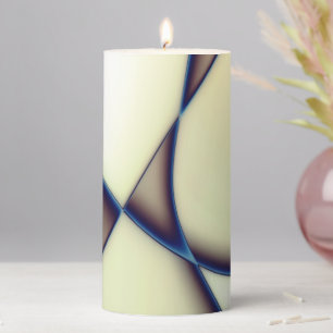 Dark curved lines on blue shadow over cream beige  pillar candle