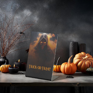 Dark demon with orange smoke halloween pedestal sign