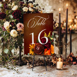 Dark Elegant Summer Sunset Floral Wedding Table Number<br><div class="desc">Celebrate the beginning of your forever with invitations as breathtaking as the sunset itself! Introducing our stunning sunset inspired wedding suite, adorned with a vibrant spray of realistic flowers in hues of orange, yellow, red, and pink, perfectly mirroring the colors of a picturesque sunset. Each petal and leaf is meticulously...</div>