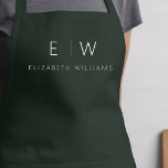 Dark Green Elegant Modern Minimalist Monogram Name Apron<br><div class="desc">Elevate your culinary experience with our Classic Elegant Modern Minimalist Monogram Name Cooking Apron. This kitchen essential seamlessly merges timeless elegance with contemporary minimalism. Crafted with precision, this apron is not just a practical accessory but also a statement of personal style. The customizable monogram and name option allows you to...</div>