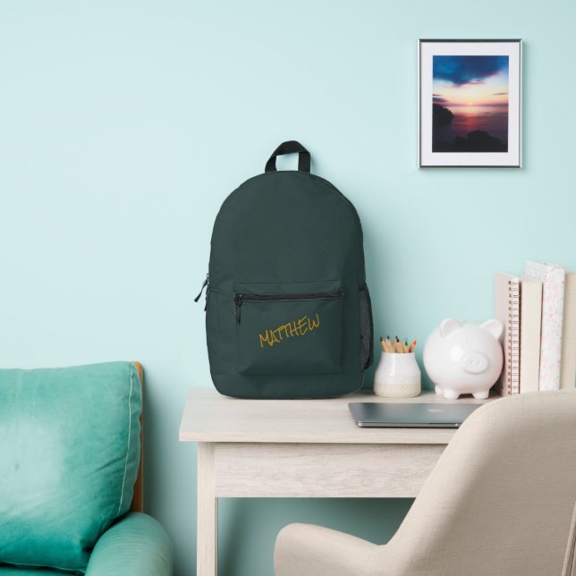 Dark green modern gold lettering script printed backpack (Insitu)