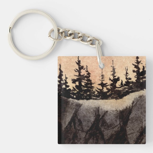 Dark pines on sheer cliff with grayed pink sky art keychain (Front)