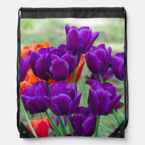 Dark purple tulips  on a sunny day in the garden drawstring bag
