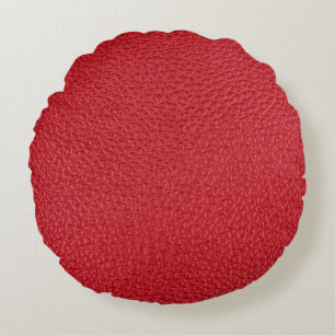 Dark red artificial leatherette closeup. round pillow