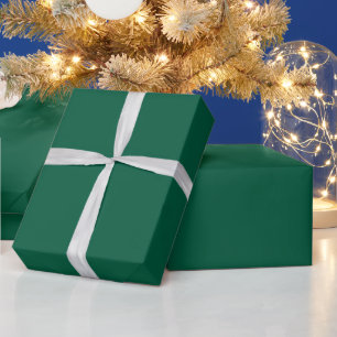 dark teal-green folder mockup above a matching wrapping paper