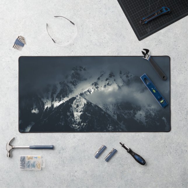 Darkness and clouds over the mountains desk mat (Workstation)