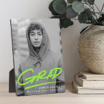 Dashed Lime Green Graduation Photo Plaque<br><div class="desc">Celebrate your graduate’s achievement with a personalized graduation photo plaque featuring their vertical photo and the word “Grad” in vibrant lime green handwritten lettering with a stylish dash beneath. This modern graduation keepsake can be customized with the graduate’s name, school, and graduation year, creating a meaningful and lasting memento of...</div>