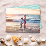 Dashing Through The Sand Vacation Photo Holiday Card<br><div class="desc">This beach themed holiday photo card features white calligraphy script that says "Dashing through the Sand" over a horizontal photo. On the back is a simple aqua and white diagonal stripe pattern. You can remove the pattern and add another photo or additional text... Scroll down to the bottom of the...</div>