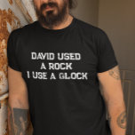 David Used a Rock I use a Glock T-Shirt<br><div class="desc">This design may be personalized in the area provided by changing the photo and/or text. Or it can be customized by clicking Personalize this Template and then choosing the click to customize further option and delete or change the color of the background, add text, change the text color or style,...</div>