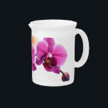 Dawn Bloom Orchid Beverage Pitcher<br><div class="desc">This captivating pattern features a cluster of vibrant pink orchids on a slender branch, set against a backdrop of a bright, expansive sky subtly painted with the soft blush of dawn and a hint of warm orange. It celebrates the delicate strength of the orchid as it greets the new day,...</div>
