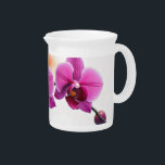 Dawn Bloom Orchid Beverage Pitcher<br><div class="desc">This captivating pattern features a cluster of vibrant pink orchids on a slender branch, set against a backdrop of a bright, expansive sky subtly painted with the soft blush of dawn and a hint of warm orange. It celebrates the delicate strength of the orchid as it greets the new day,...</div>
