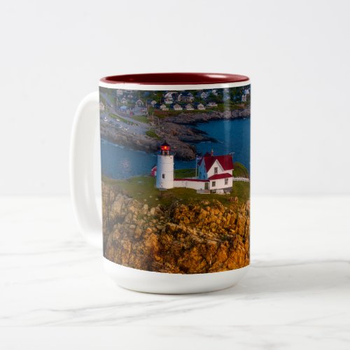 Dawns Light breaks on the Nubbles Rocky shoreline Two_Tone Coffee Mug