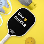 Day Dinker Custom Text Name Funny Pickleball Paddle<br><div class="desc">This funny pickleball paddle reads "DAY DINKER" in a bold white text that's set against a black background and highlighted by a yellow pickleball (you can easily change the background color). Add 2 lines of custom text to personalize - club name, location, player's name, phone number, etc. Or delete. Makes...</div>