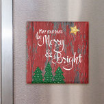 Days Be Merry Bright Red Wood Trees Gold Star Magnet<br><div class="desc">“May your days be merry & bright.” A playful illustration of a white script typography quote, green trees, and a gold glitter star against a rustic red country barn wood background helps you usher in Christmas and New Year. Feel the warmth and joy of the holiday season whenever you use...</div>