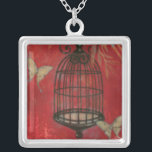 Decorative Birdcage with Butterflies Silver Plated Necklace<br><div class="desc">Two pale butterflies hover around a birdcage in this painting by Norman Wyatt. Leaves hang over the birdcage,  and it all rests on a crimson background. Order this print today!</div>