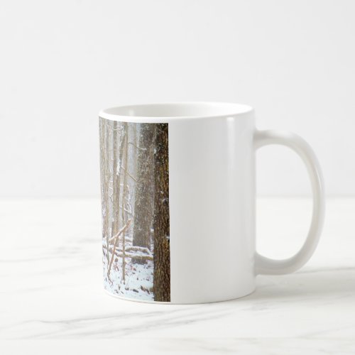 Deer in the snow licking leg coffee mug