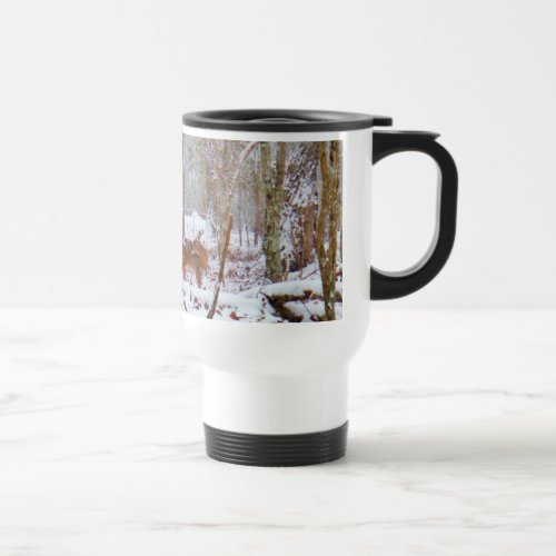 Deer in the snow licking leg travel mug