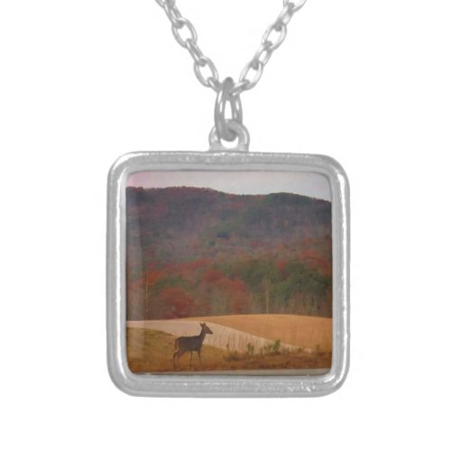 Deer on sunset golf course silver plated necklace
