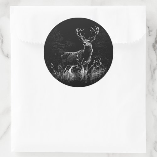 Deer with antlers framed by field and tree   classic round sticker