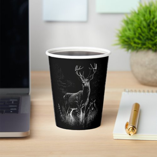 Deer with antlers framed by field and tree     paper cups