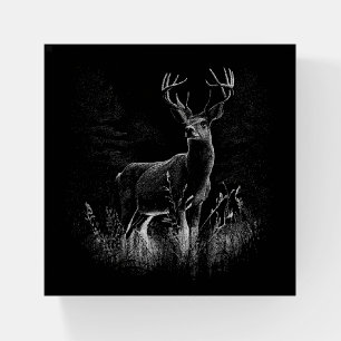 Deer with antlers framed by field and tree        paperweight