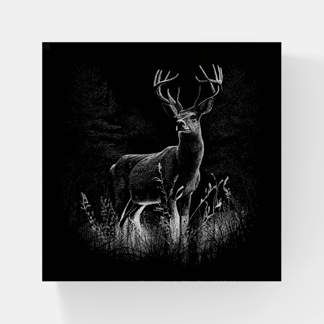 Deer with antlers framed by field and tree        paperweight (Front)