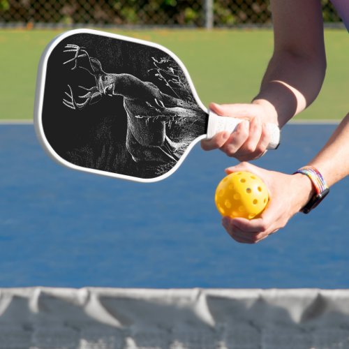 Deer with antlers framed by field and tree  pickleball paddle