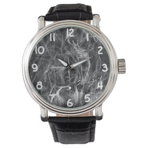 Deer with antlers framed by field and tree watch