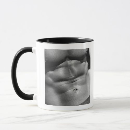 Defined abdomen of bodybuilder mug