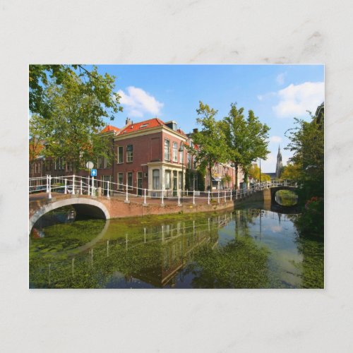 Delft canal bridge and old houses postcard