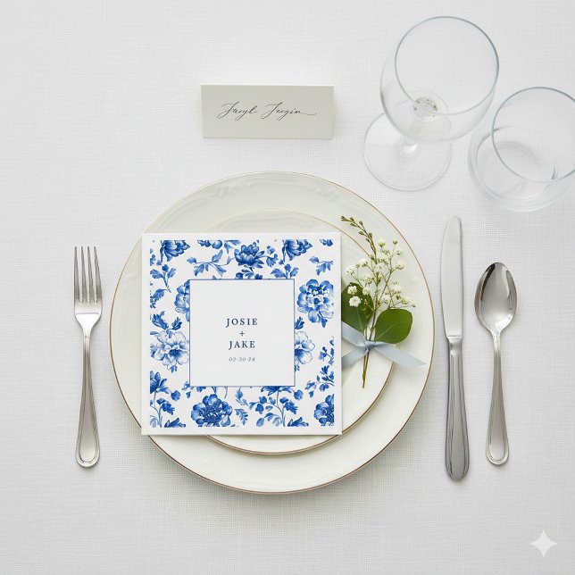 Delftware blue and white wedding napkin (White and blue delftware wedding napkin with bride and groom names.)