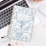 Delicate Blue White Floral Pattern Monogram 2024 Planner<br><div class="desc">Personalize this planner with your name in blue italics framed by a white rectangle,  on a delicate botanical pattern of blue line art flowers and foliage on a white background.</div>