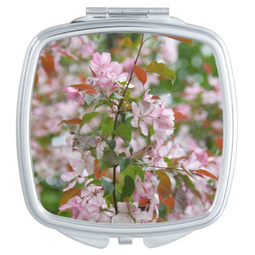 Delicate branch with flowers apple tree compact mirror